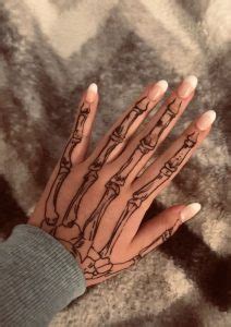 100 Stunning Skeleton Hand Tattoos Meanings Tattoo Me Now 100 Stunning Skeleton Hand Tattoos Meanings Tattoo Me Now