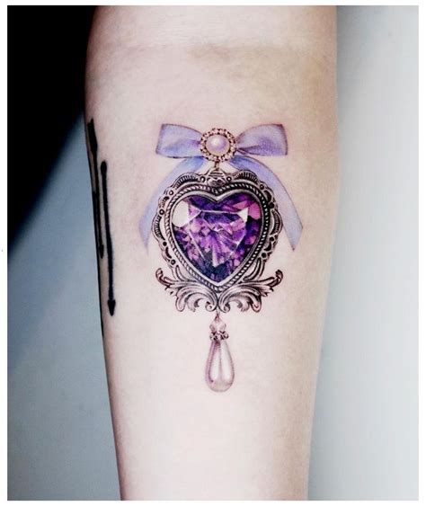 12 Stunning Jewel Tattoo Designs For A Touch Of Glamour Jewelry Tattoo Heart Locket Tattoo