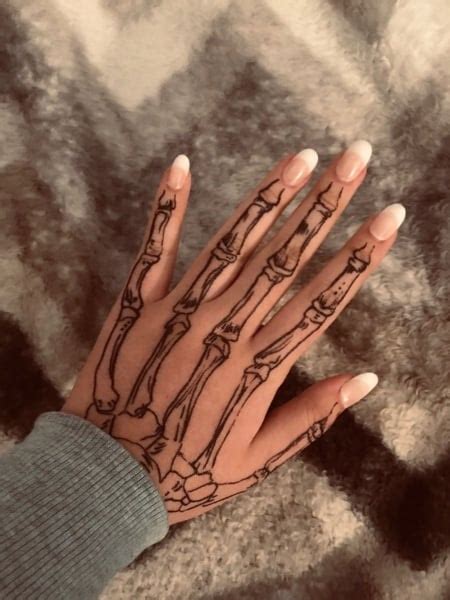 20 Cool Skeleton Hand Tattoo Ideas Meaning 20 Cool Skeleton Hand Tattoo Ideas Meaning