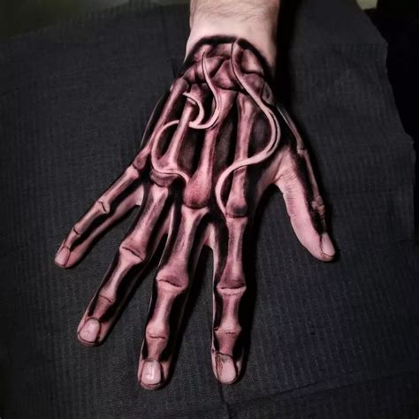 61 Skeleton Hand Tattoo Ideas With Deep Meanings