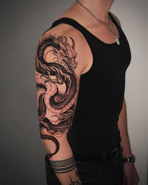Bold Dragon Tattoo Design For Arm Art Lovers In 2025 Dragon Tattoo Arm Dragon Tattoos For Men Bold Dragon Tattoo Design For Arm Art Lovers In 2025 Dragon Tattoo Arm Dragon Tattoos For Men