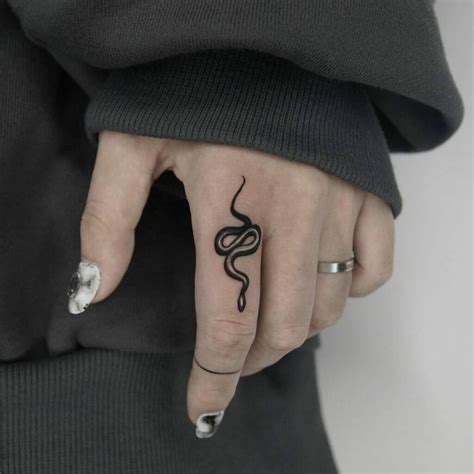 Enchanted Snake Tattoo On Finger