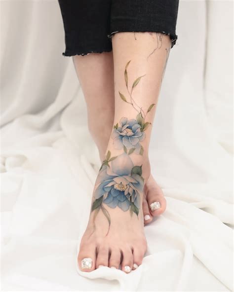 Floral Tattoo Design On Top Of The Foot Foot For Booking Inquires Send Me A Direct Msg Tattooideas Tattooartist Tattoo Floraltattoo Fineline