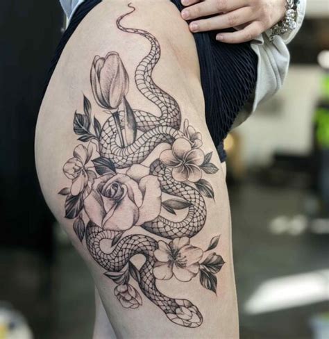 Illustrative Black Ink Snake Tattoo On A Thigh And Hip On Craiyon