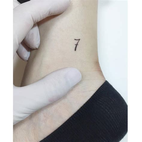 Minimalistic Number 7 Tattoo Located On The Ankle Minimalistic Number 7 Tattoo Located On The Ankle