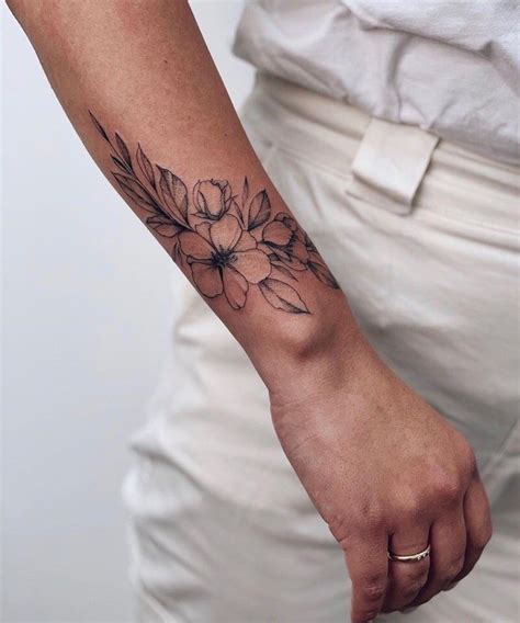Pin By Kristen Von On Tattoo Flower Wrist Tattoos Wrap Around Wrist Tattoos Around Arm Tattoo