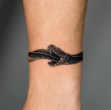 Snake Eating Itself Tattoo Meaning