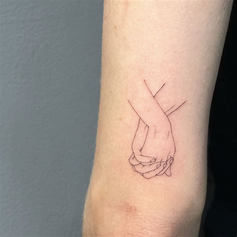 Two Hands Holding Tattoo Meaning At Hudson Hawker Blog Two Hands Holding Tattoo Meaning At Hudson Hawker Blog
